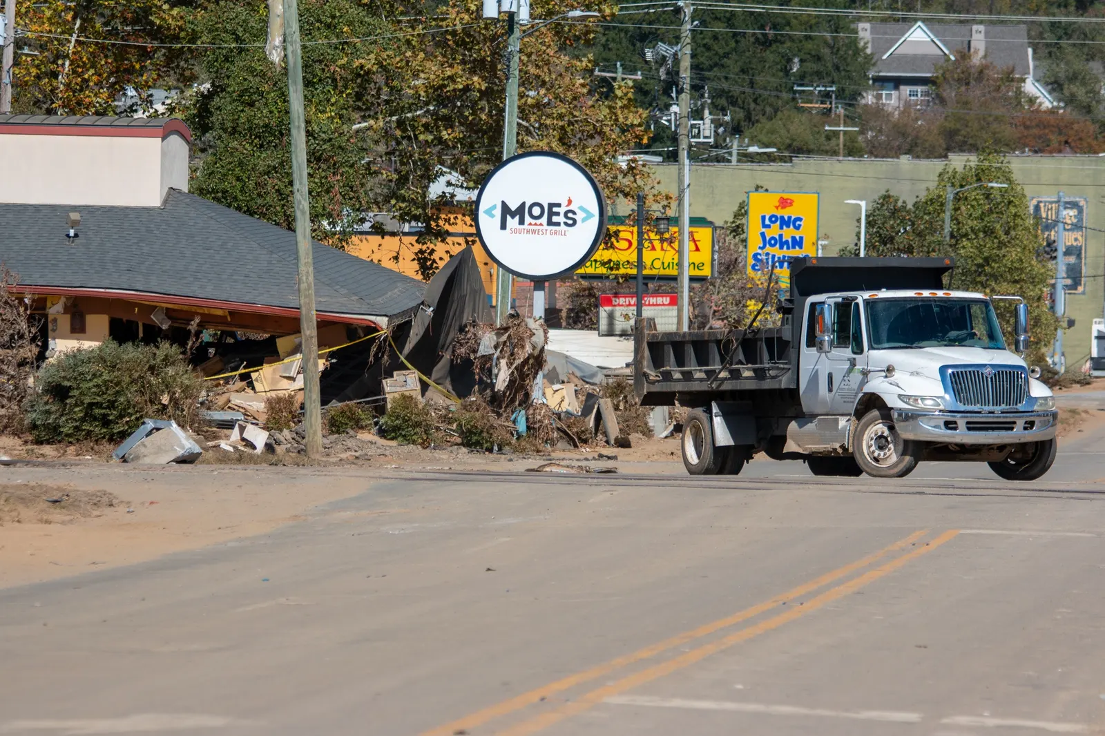 Cleanup continues in the hard-hit downtown area of Biltmore Village, North Carolina, on Oct